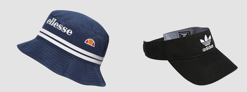 Visors and bucket hats from brands such as adidas Originals, Ellesse, and Nike. 