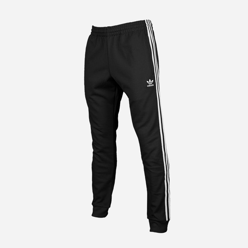 Shop the Men's adidas Originals Superstar Track Pants in black.