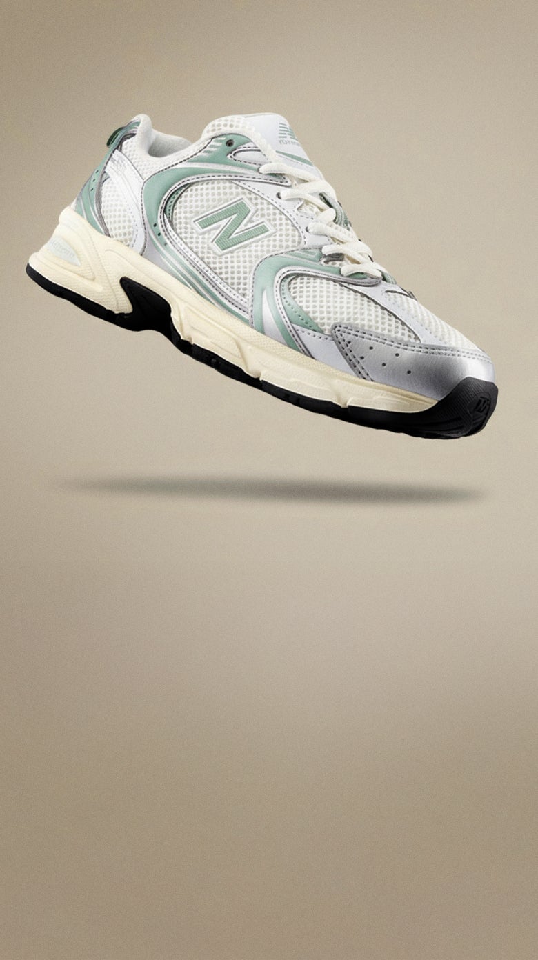 NEW BALANCE 530. The it-girl shoe of 2025. Featuring a new colourway in metallic silver and pale green, the 530 applies a contemporary, everyday style outlook to a performance-minded design. SHOP 530