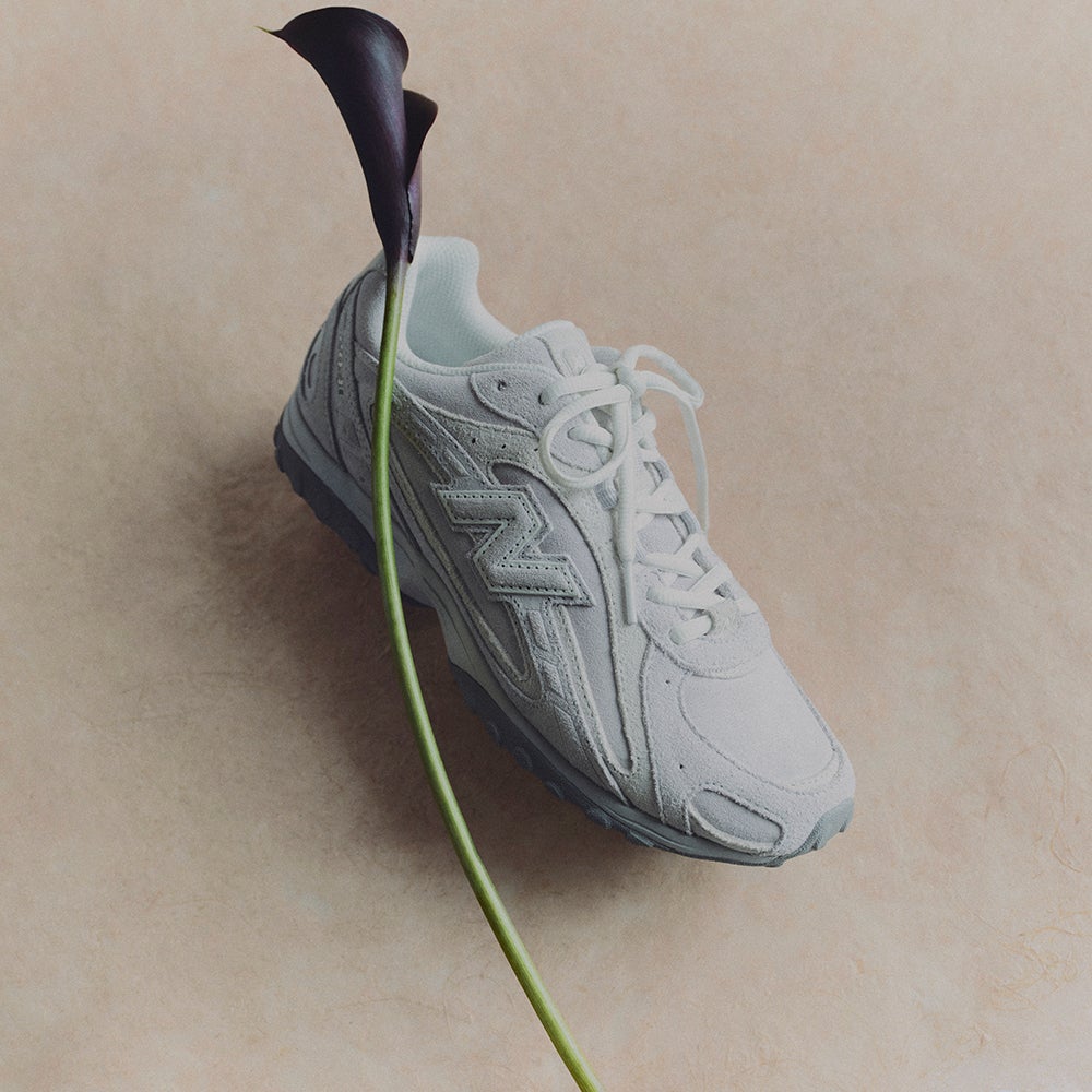 Shop New Balance 204L Sneakers