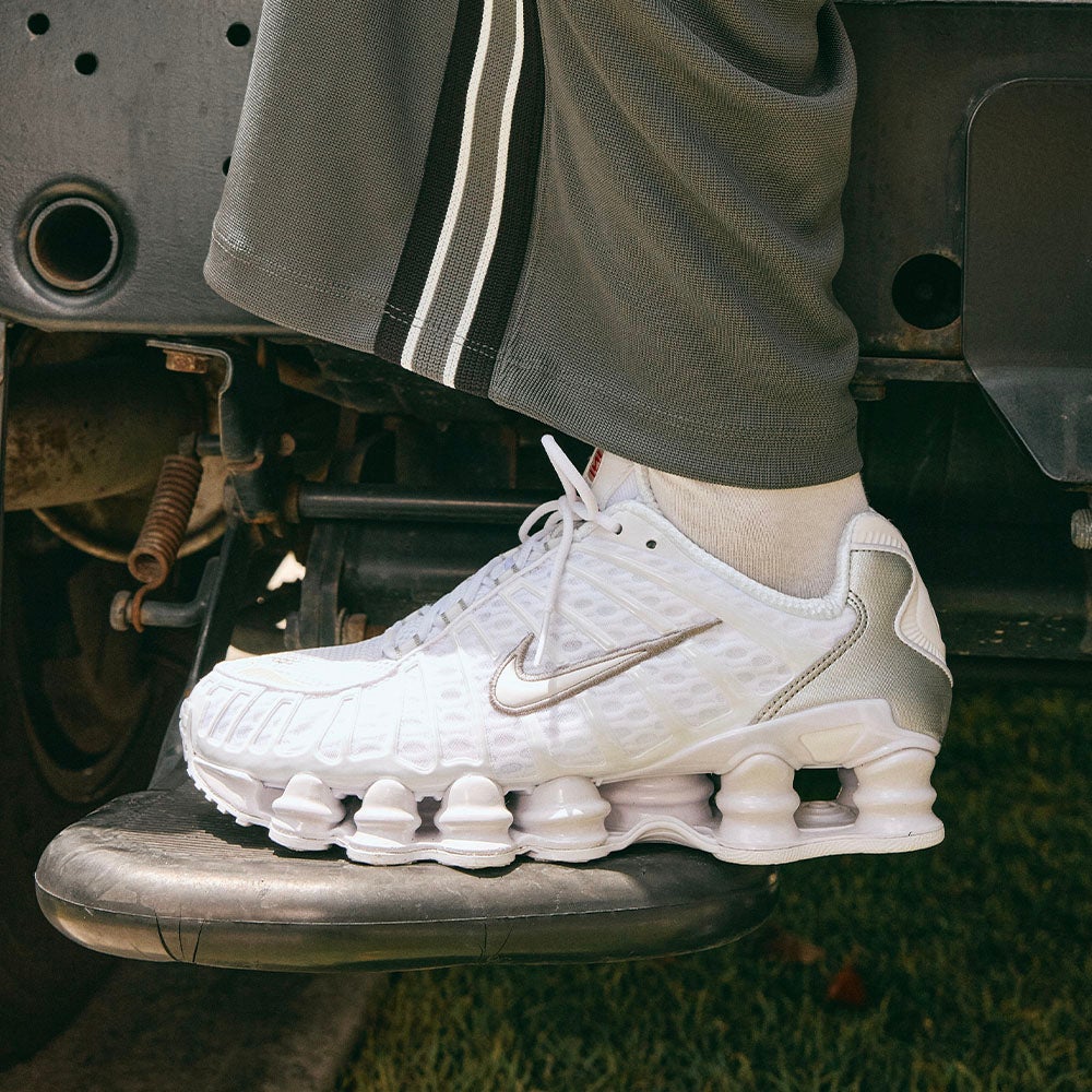 PURE METALLIC ENERGY. A crisp white upper meets metallic silver detailing for a Shox TL that turns heads from every angle. SHOP SHOX