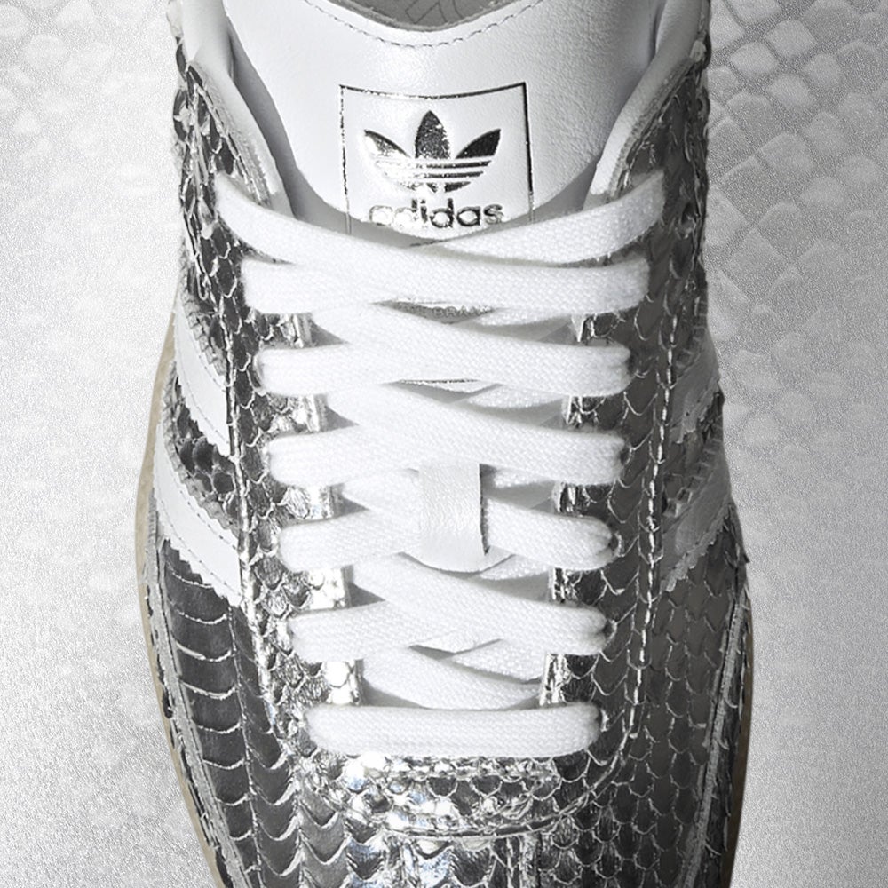 STRIKE IN STYLE High-gloss snakeskin takes the Samba from staple to statement. SHOP THE STYLE