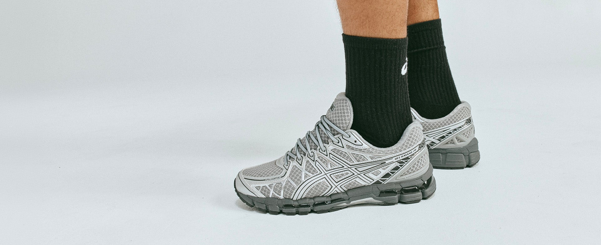 ASICS KAYANO ESSENTIAL GEL-KAYANO 20 in white and silver built for all-day wear. SHOP THE STYLE