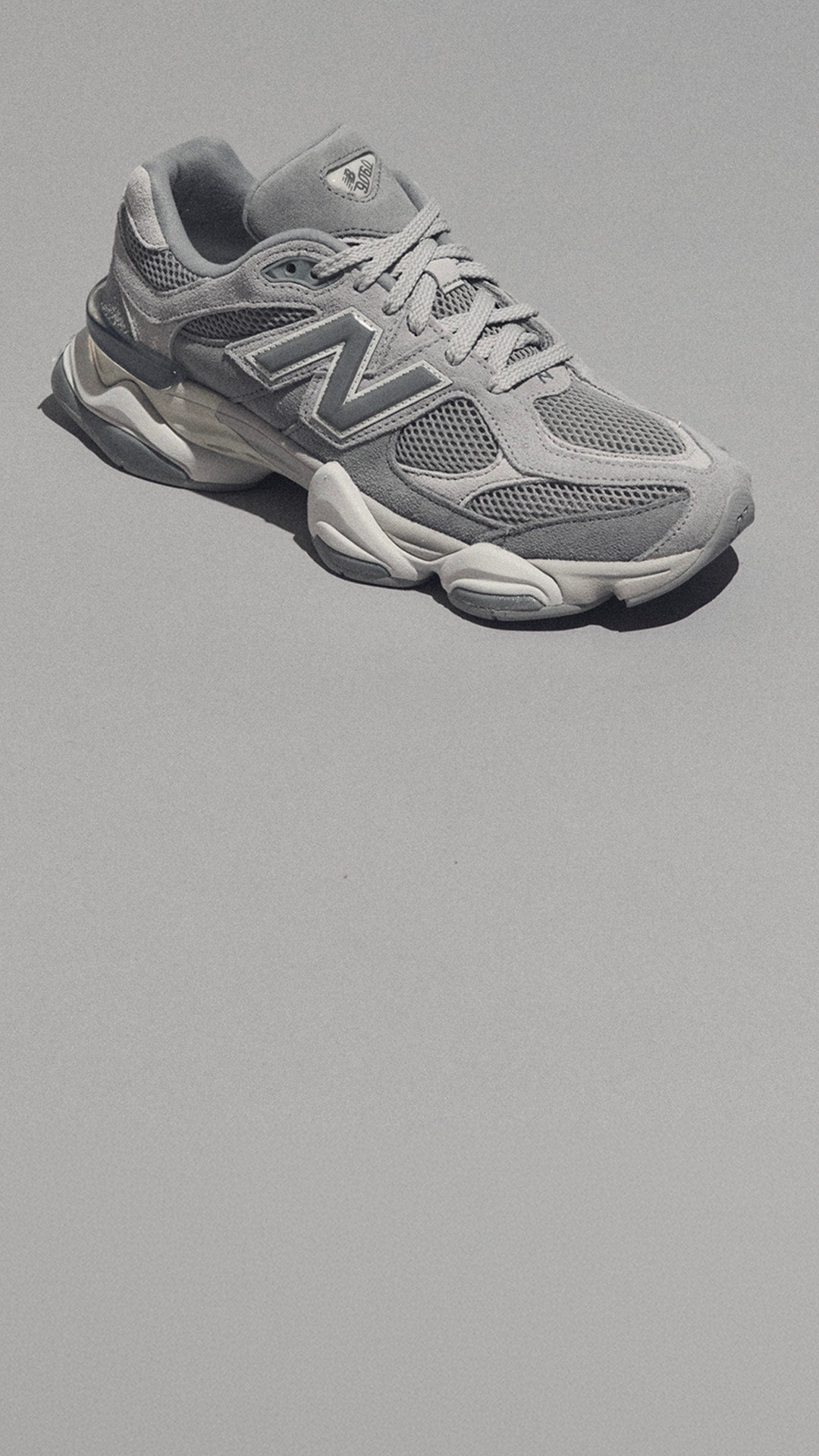 9060 ICON in GREY New Balance heritage reworked with bold shape and clean grey style. SHOP THE STYLE