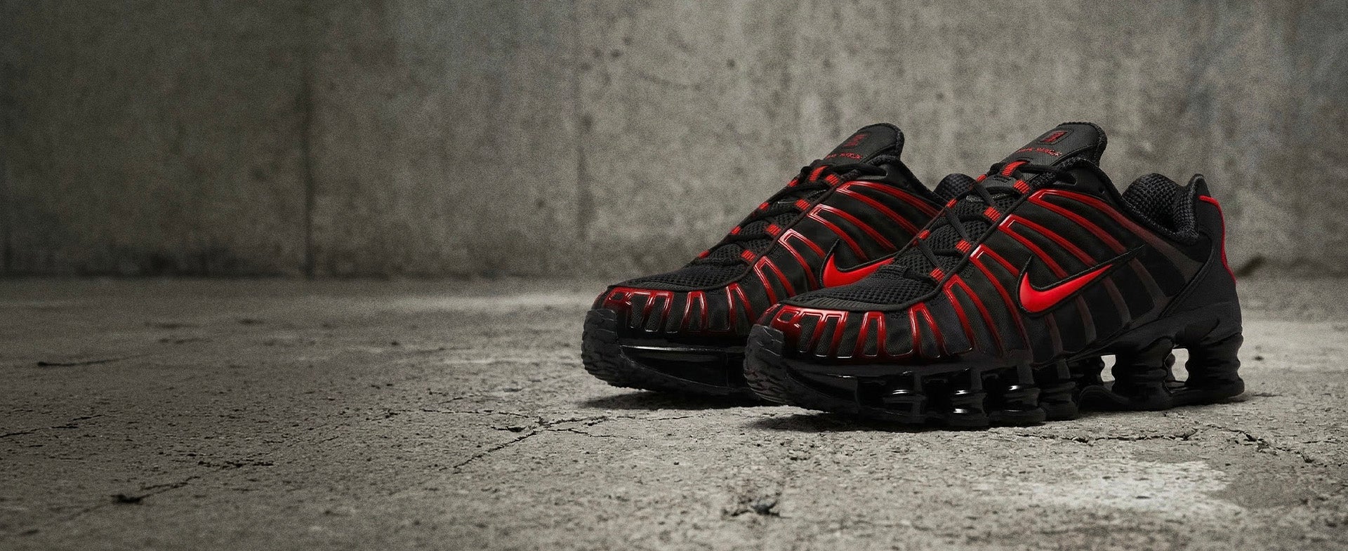 OWN THE STREET. Nike Shox TL brings bold cushioning in black and crimson. SHOP SHOX