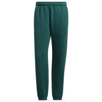 adidas Originals CLASSICS TRACK PANT LOOSE - Tracksuit bottoms - collegiate  green/true pink/green 