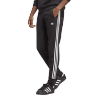 White adidas pants with black sales stripes