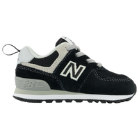 New Balance 574 trainers in metallic white and silver