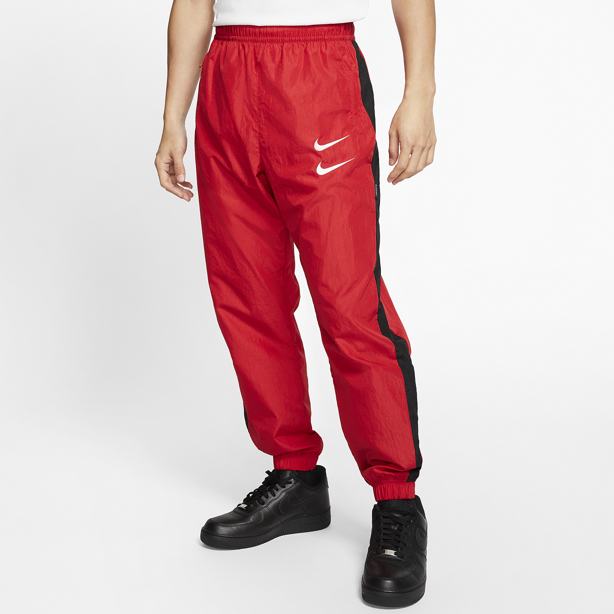 red nike swoosh pants