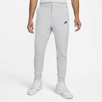 Order NIKE NSW Woven Track Pant UV bronzine/bronzine Pants from solebox