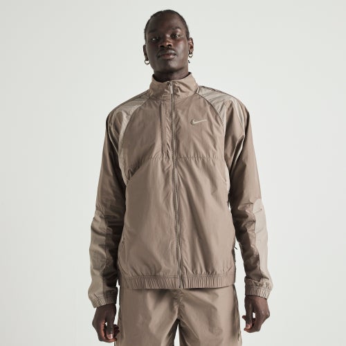 Nike NOCTA Northstar Nylon Track Jacket Image 1 of 10. Tap to open photo gallery.