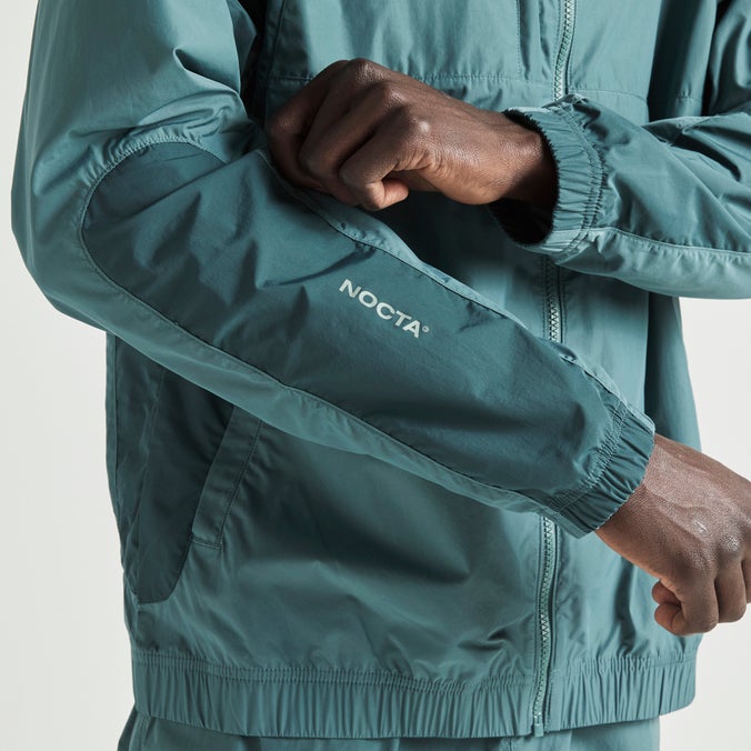 Nike NOCTA Northstar Nylon Track Jacket Image 4 of 10. Tap to open photo gallery.
