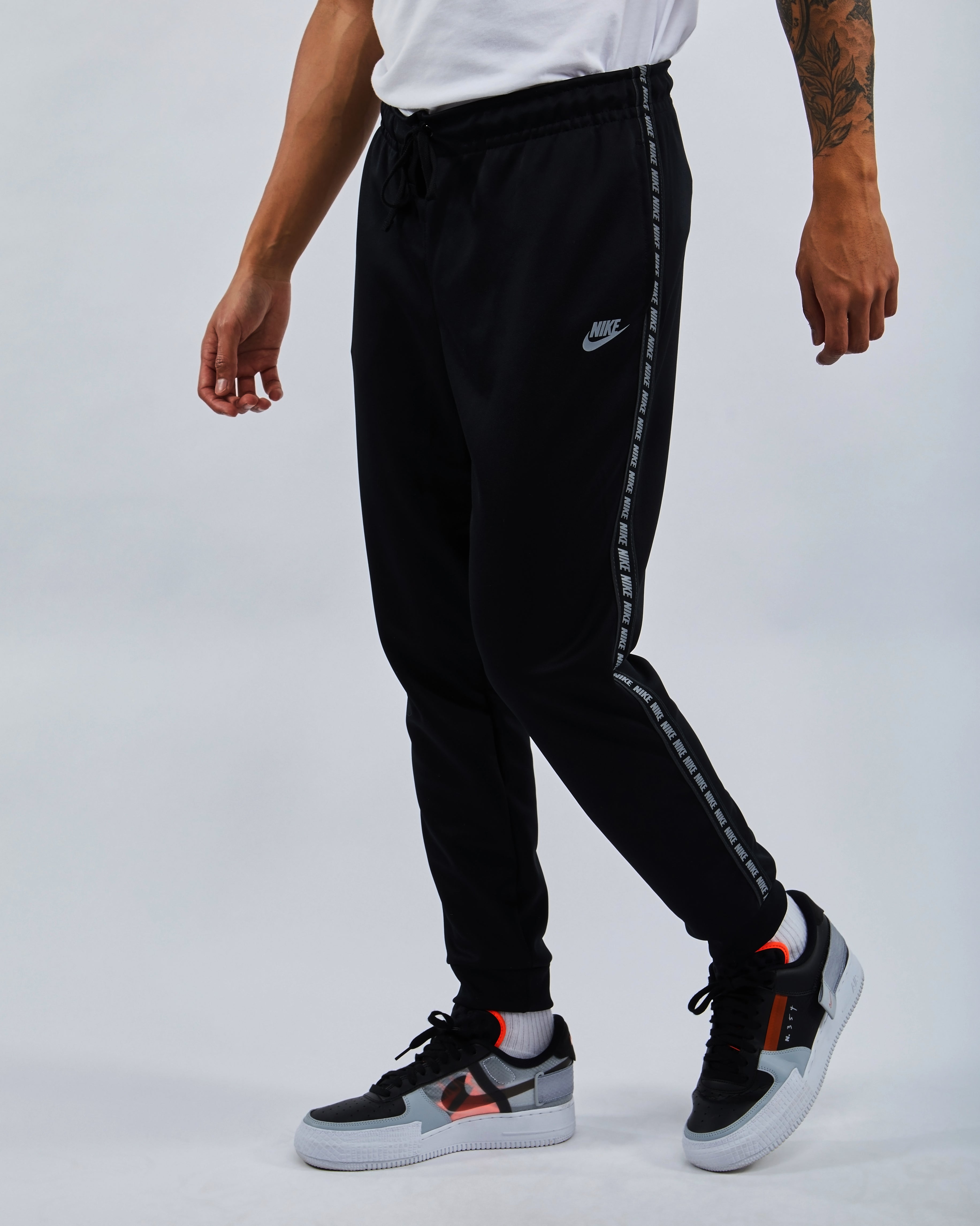 nike repeat poly pants